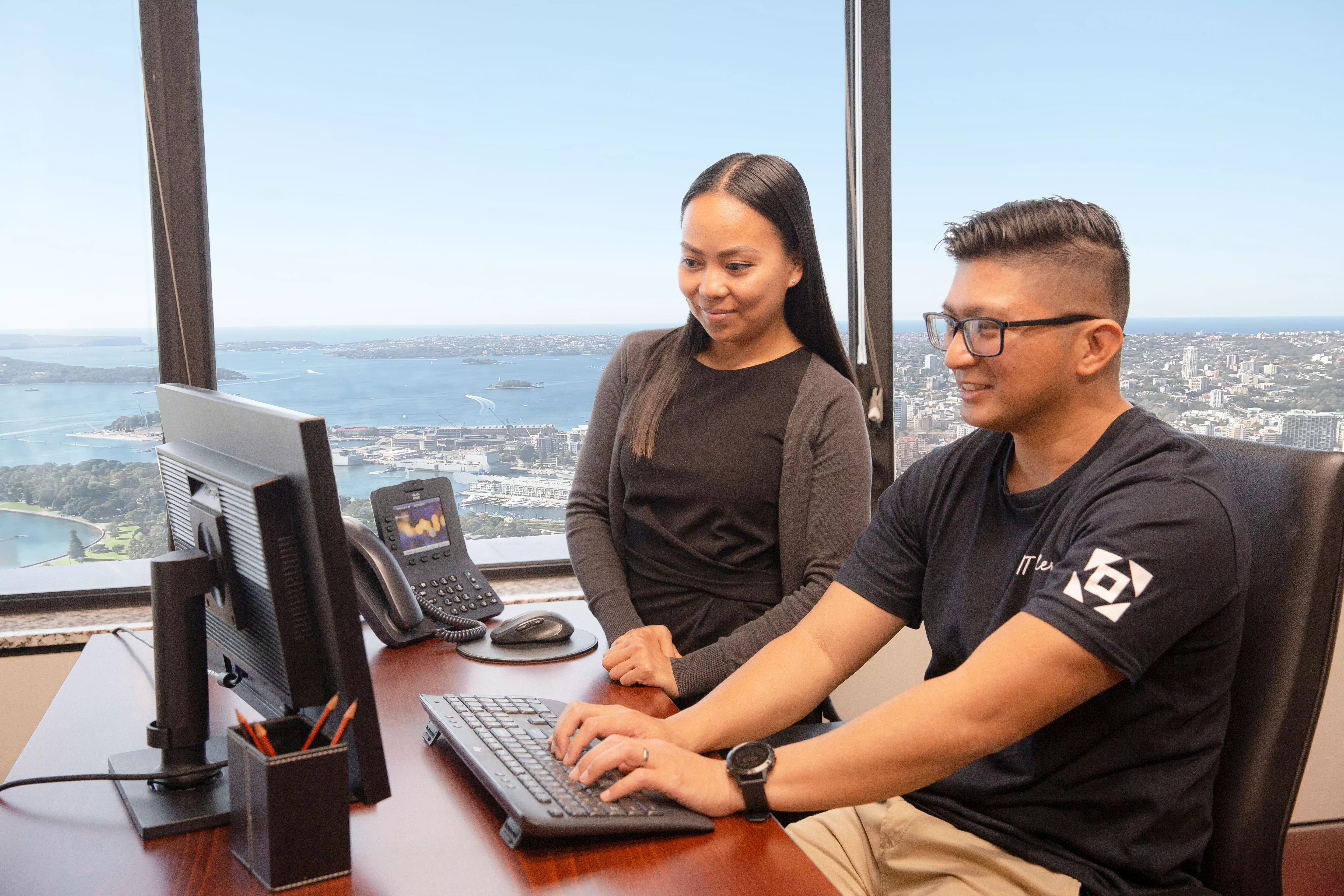 Client receiving IT help from a specialist