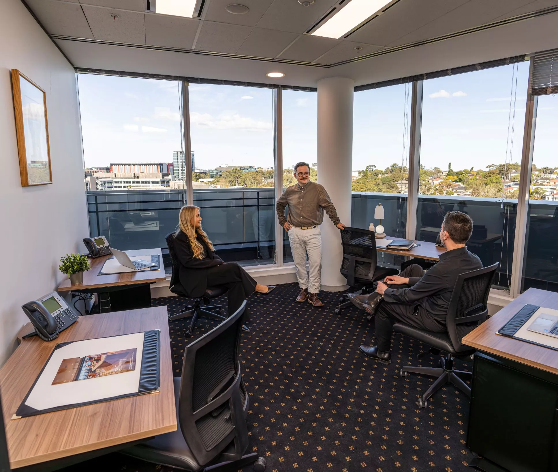 Collaborative breakout spaces with clients enjoying the newly renovated modern co-working spaces in Servcorp Avaya House, Macquarie Park